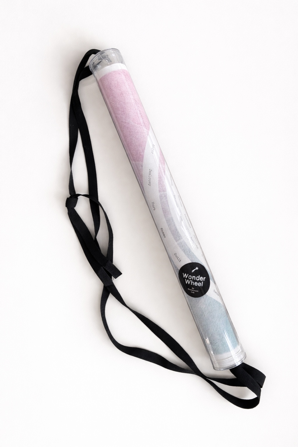WonderWheel kit in a clear tube with strap.