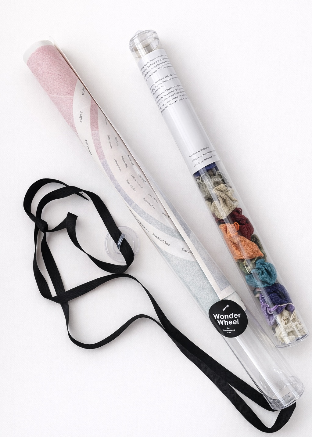 Two WonderWheel tubes — canvas and linen pouches.